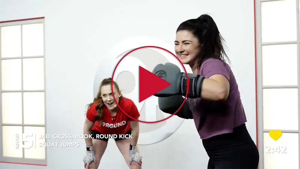 9Round trainers punching during an at-home kickboxing workout